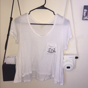 white cropped shirt with front pocket
